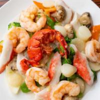 S9 . Seafood Delight · Shelled lobster meat, sea scallop and jumbo shrimp sauteed with fresh vegetables in a white ...