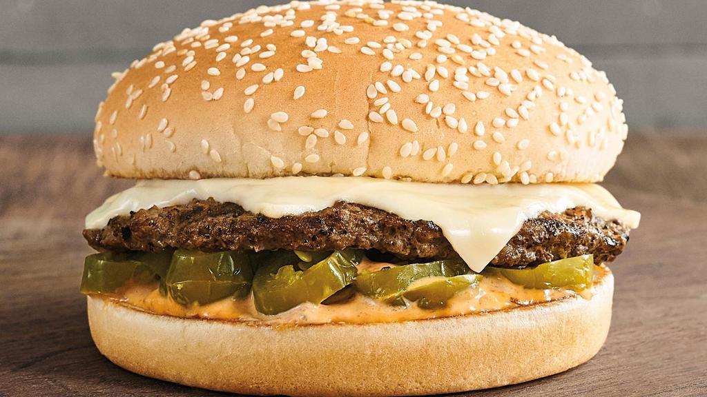 Barn Burner® · A 1/4 lb. 100% USDA fire-grilled pure beef patty, sliced jalapeños, 2 slices of pepper jack cheese, and our house-made Fiery Farmer’s Sauce on a locally baked toasted sesame seed bun. This one is a flamethrower for your tastebuds.