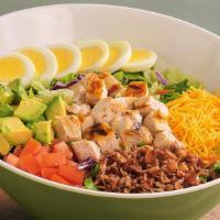 Farmer’S Chopped Cobb Salad™ · Everything you crave on farm fresh greens. Grilled all-natural chicken breast, hand-diced Ha...
