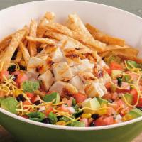 Southwest Chicken Salad · Loaded with grilled all-natural chicken breast, fire-roasted corn, black beans, shredded che...