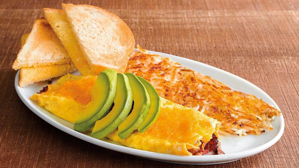 California Omelet · What’s not to love, dude or dudette? 3 cage-free eggs, hand-cracked and cooked-to-order, with hickory-smoked bacon, shredded cheddar cheese, and topped with hand-sliced Hass avocado. Served with your choice of crispy hash browns or freshly sliced tomato or hand-sliced fresh fruit, and toast of your choosing. The best of the West.
