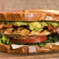 Sourdough Chicken Avocado Sandwich · Stacked high with grilled all-natural chicken breast, thick hickory-smoked bacon, hand-smash...