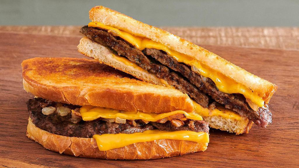 Patty Melt · Loaded with 1/4 lb. of USDA fire-grilled pure beef, American cheese, and grilled onions. All on locally-baked toasted sourdough bread. This one will melt your appetite.