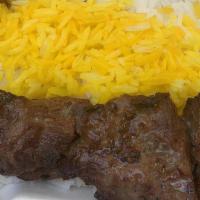 Beef Kebab Plate · Six pieces of filet mignon with rice, a green salad, hummus, grilled tomato, pita bread and ...