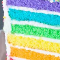 Rainbow Cake Slice · Six layers of rainbow-colored vanilla cake filled and iced with sweet vanilla buttercream ic...