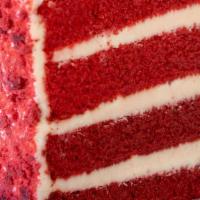 Red Velvet Cake Slice · Red velvet cake filled and iced with cream cheese frosting. Decorated with red velvet cake c...