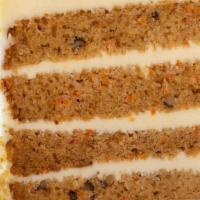 Carrot Cake Slice · Our classic carrot cake contains chunks of pineapple, chopped walnuts, coconut shavings, and...