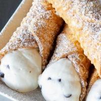 Classic Cannoli · Crispy Italian shell filled with sweet ricotta cheese, chocolate chips, and a hint of cinnam...