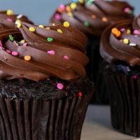 Chocolate Fudge Cupcake · Chocolate cupcake topped with rich chocolate fudge icing and sprinkles.