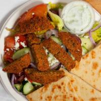 #2. Falafel Salad · Made with fresh mixed greens topped with a red wine vinaigrette flavored with greek herbs an...