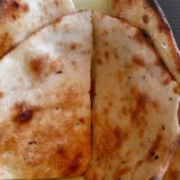Tandoori Naan · Dough made from flour and milk, perfectly baked in tandoor.
