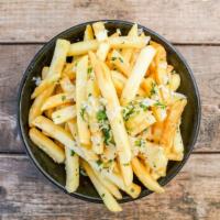 Truffle Fries · House-cut fried potatoes, fresh-minced herbs, shaved parmesan, truffle oil