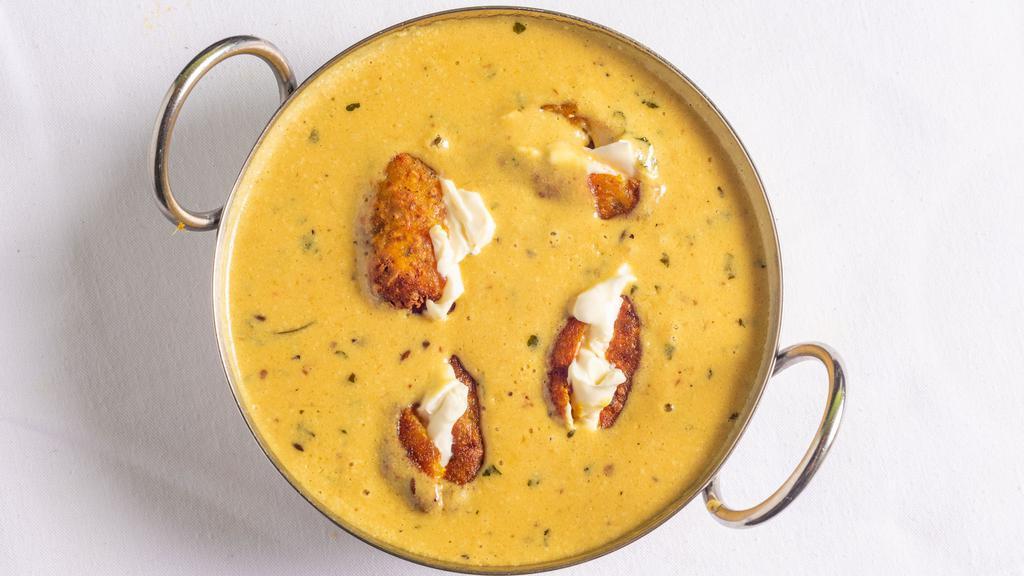Malai Kofta · Veggie. Croquettes made from soft homemade cheese, potatoes and vegetables simmered in a delicious rich creamy sauce infused with cashew nuts and raisins.