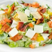 Johnny'S Chopped Salad · Chopped romaine tossed in Italian vinaigrette and ranch dressing. Topped with applewood smok...