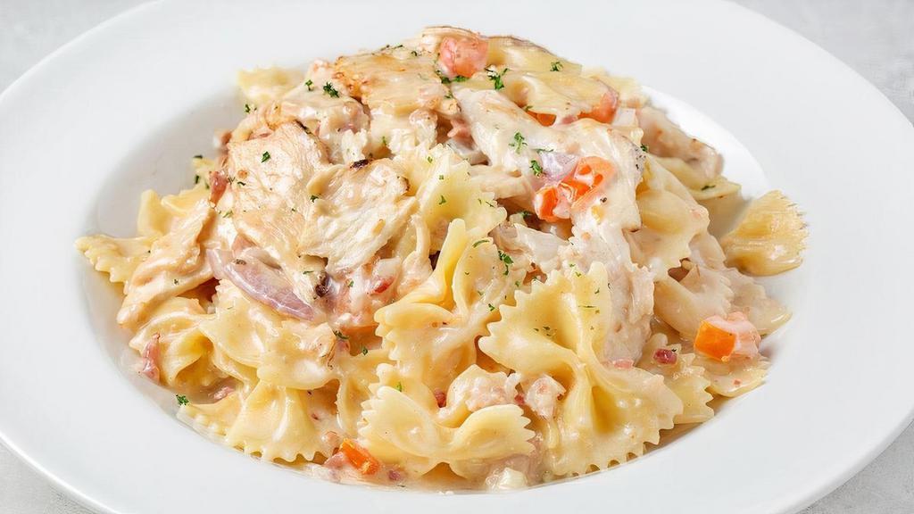 Grilled Chicken Bowtie Festival · Bowtie sautéed with sliced chicken, bacon, garlic, red onions, Roma tomatoes and Asiago cream sauce.
