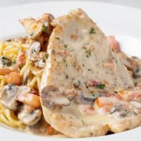 Chicken Scaloppini · Sautéed chicken breast, mushrooms, Roma tomatoes, bacon and lemon butter cream sauce. Served...