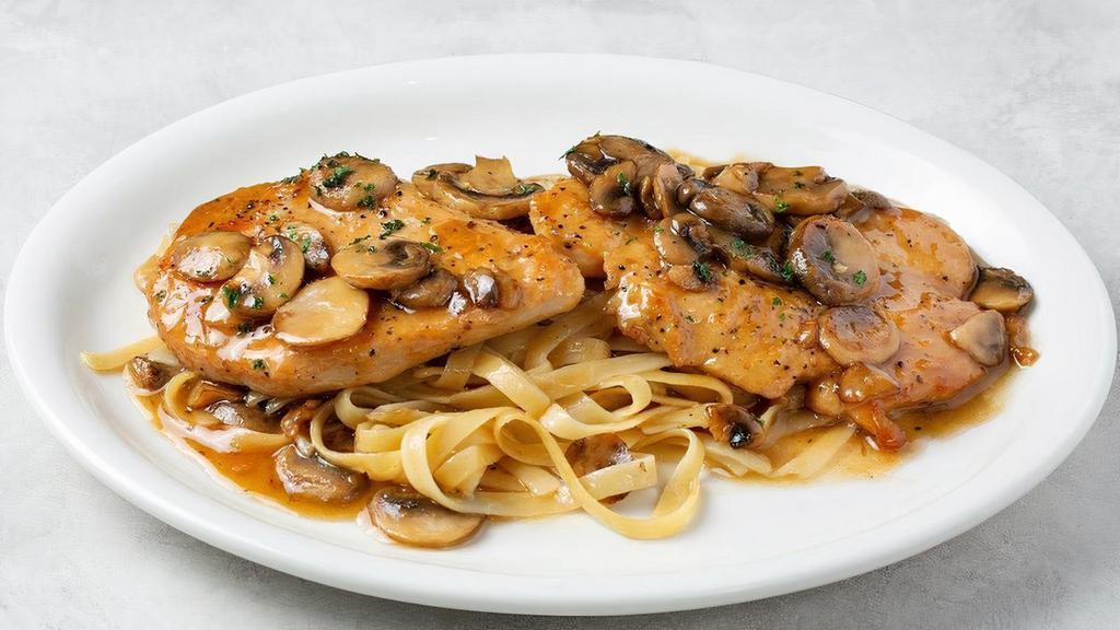 Chicken Marsala · Sautéed chicken breast with mushrooms and sweet wine sauce. Served with your choice of fettuccine or sautéed spinach.