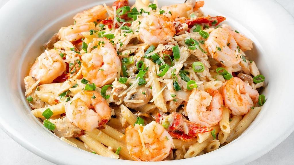Spicy Shrimp & Chicken Family Platter · Penne sautéed with shrimp, sliced chicken, cayenne pepper, Romano cream sauce, mushrooms, sun-dried tomatoes and green onions.