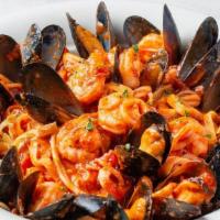 Seafood Fettuccine Family Platter · Tender calamari, shrimp and mussels sautéed with fresh garlic and tossed with fettuccine in ...