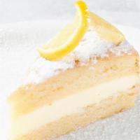 Lemon Cream Cake · Two layers of lemon soaked cream cake filled with lemon mascarpone mousse and finished with ...