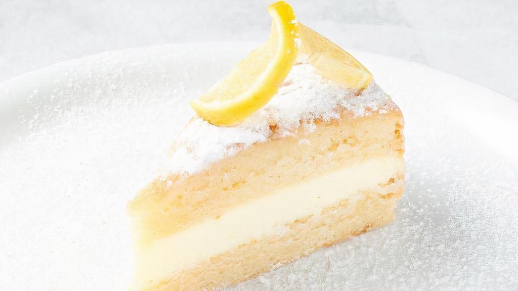 Lemon Cream Cake · Two layers of lemon soaked cream cake filled with lemon mascarpone mousse and finished with powdered sugar.