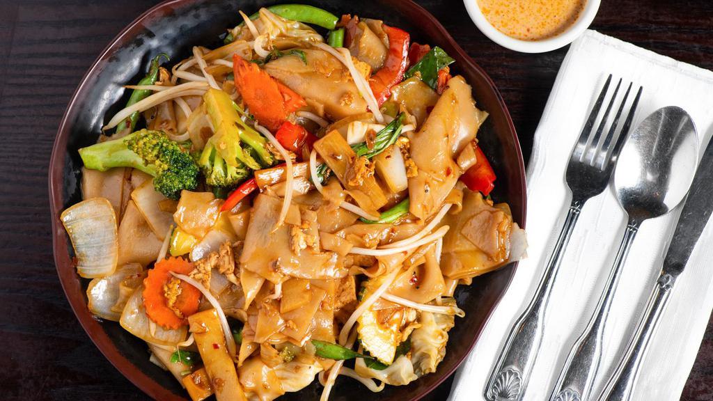 Drunken Noodle · Wide flat rice noodles stir fried with your choice of meat, egg, onion, basil, bamboo, bell pepper, bean sprout in fresh chili garlic sauce.