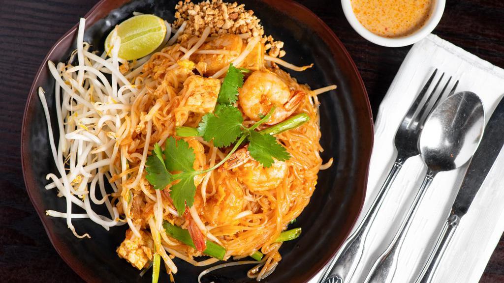 Pad Thai · Rice stick noodles stir fried with choice of meat, egg, tofu, bean sprout, green onion in Pad Thai sauce, topped with ground peanut.