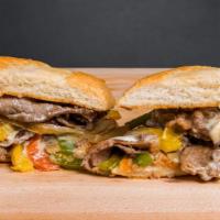 Philly Cheesesteak · Freshly baked french roll with thinly sliced ribeye, bell peppers, onions, swiss cheese, and...