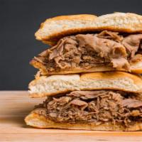French Dip Sandwich · Freshly baked french roll with thinly sliced beef and a side of au jus.