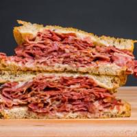 Pastrami Melt · Grilled rye bread with pastrami and melted swiss cheese.