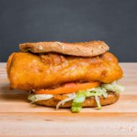 Battered Cod Sandwich · Whole wheat bun with wild-caught cod that’s battered and fried till golden brown with lettuc...