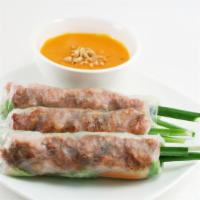 Nem Nướng Cuốn - Seasoned Pork Patty Spring Rolls · Contains gluten. 3 - seasoned pork patty wrapped in rice pepper with cucumber, lettuce, carr...