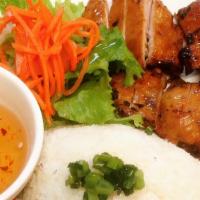 Cơm Tấm Gà Nướng · Grilled chicken over rice with side salad.