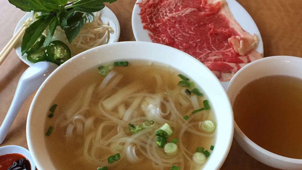 Phố Tái New York Steak · 5 oz of New York steak strip in a rich beef broth with fresh rice noodles.