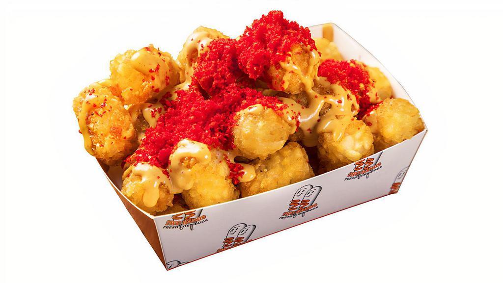 Dirty Fries · Deep fried potato tater puff with two hands dirty sauce and cheetos powder.