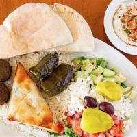 Veggie Combo · Best of all! Spinach pie, falafel, dolma, hummus, Greek salad, and pita bread. Served with r...