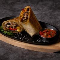 Fajita Burrito · Vegetable burrito with fajita peppers and onions, rice, beans, and pico de gallo wrapped in ...