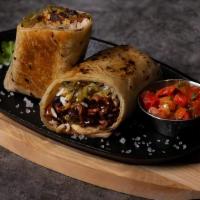 Pescado Burrito · Fish burrito with rice, beans, and pico de gallo wrapped in a flour tortilla and crisped to ...