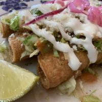Chicken Flautas Taquitos Lunch · 3 rolled and fried taquitos. Topped with lettuce, salsa suave, Cotija cheese, sour cream, an...