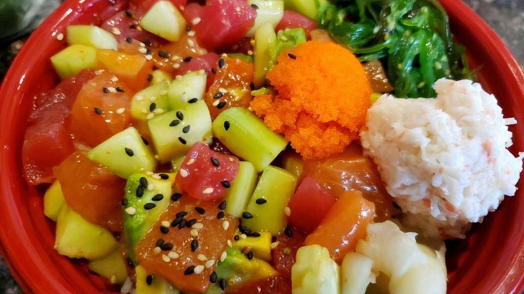 Paseo Bowl · salmon, Ahi Tuna, cucumber, avocado with house poke sauce, california krab, masago, seaweed salad, crispy onion, bbq eel sauce, spicy mayo, over sushi rice