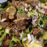 The Steak Salad · Mixed greens, tomato, cucumber, avocado, balsamic vinaigrette and steak.