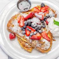 French Toast · Country pain perdu, berries, vanilla, whipped cream, maple syrup.