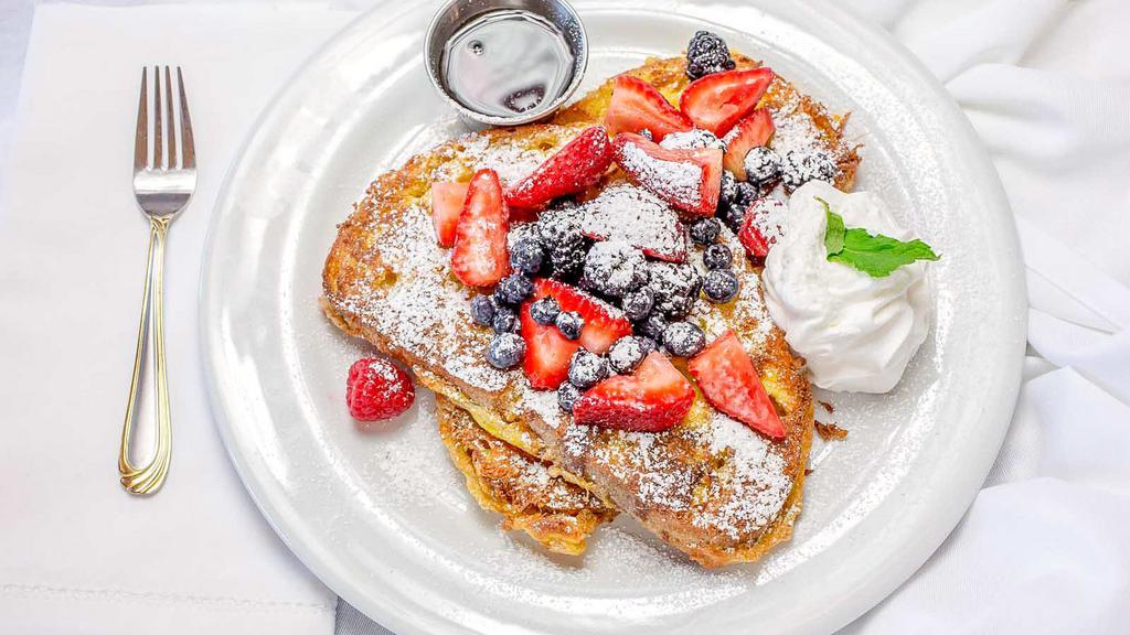 French Toast · Country pain perdu, berries, vanilla, whipped cream, maple syrup.