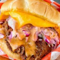 Deluxe Sandwich · Chicken tender sandwich w/ cheese, slaw, pickles + secret sauce & fries.