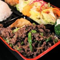 Bul-Go-Gi Box · Shredded beef ribeye, served with rice, salad, jabchae, and a potsticker.
