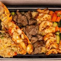 Trio Protein Plate · Served over a bed of fried rice, a side of veggies and one sauce.