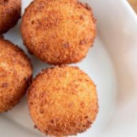Papas Rellenas · 4  pieces. Mashed potatoes stuffed with meat and shaped into balls, then lightly breaded and...