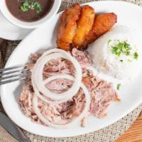 #1 Lechon Asado (Cuban Style Roasted Pork) · Classic Cuban style roasted pork marinated in Versailles uniques garlic mojo criollo sauce r...