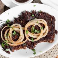 #21 Vaca Frita (Sauteed Shredded Flank Steak) · Shredded beef sauteed in olive oil with citrus juice and onions.