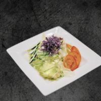 House Salad · Fresh iceberg lettuce, cucumber, and tomatoes served with house dressing.